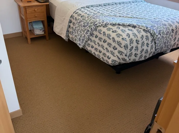 Bedroom made up neatly after cleaning