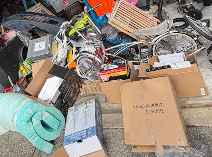 Cluttered garage before organization and cleanout